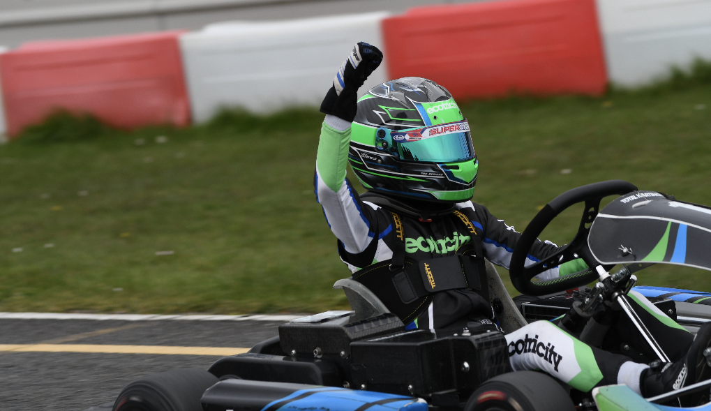 Kart Racing Driver celebrating with hand in the air